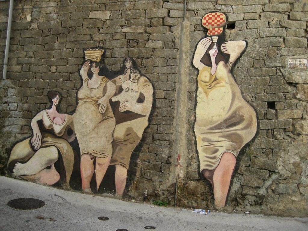 art on the walls of typical houses in sardinia