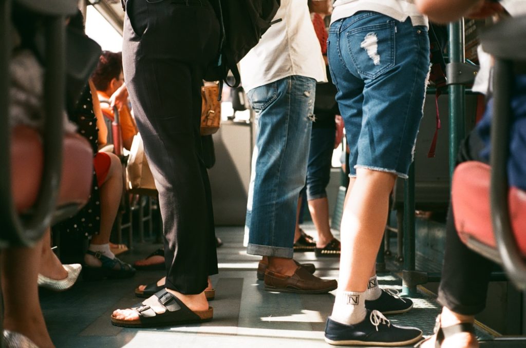 pictures with people on the bus in an article about travel tips for alghero italy sardinia