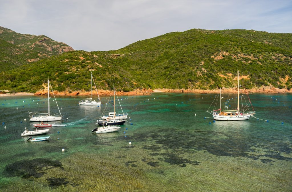 image of boats and sardinia coast